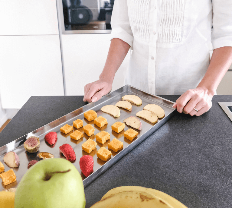 freeze dried fruit on a kichen counter next to fresh fruit