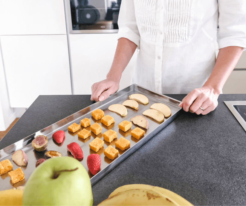 freeze dried fruit on a kichen counter next to fresh fruit